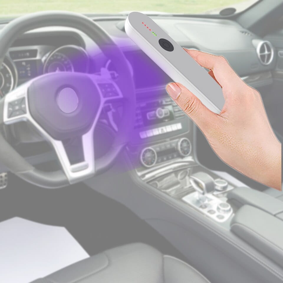 White handheld uv-c sterilizer device with led indicator lights and a circular sensor from the royale essence lux uv sanitizer stick product line.