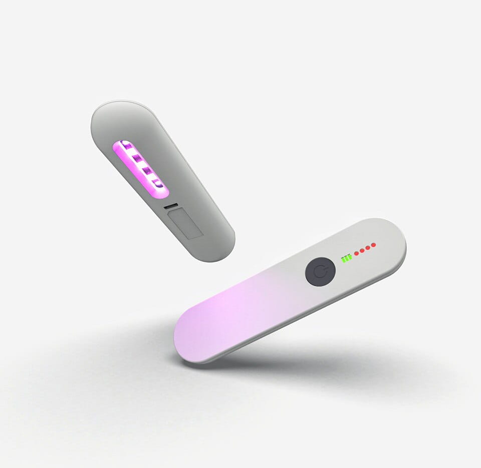 white and pink gradient uv light device with led indicators of the royale essence lux uv sanitizer stick for effective germ protection