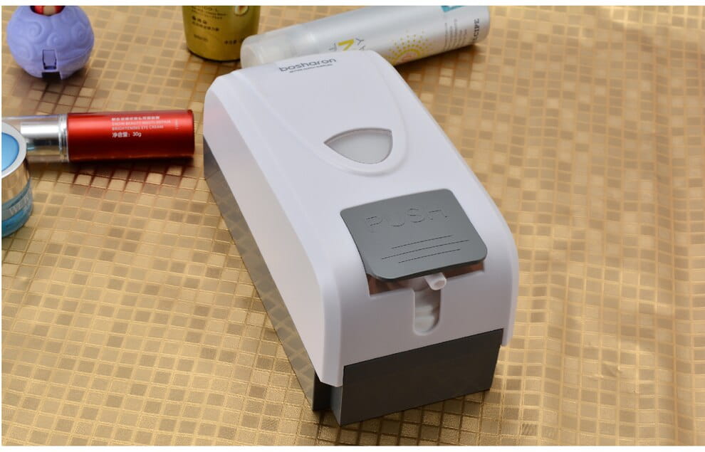 White and gray modern wall mounted foam soap dispenser with a sleek design for convenient foam soap dispensing.