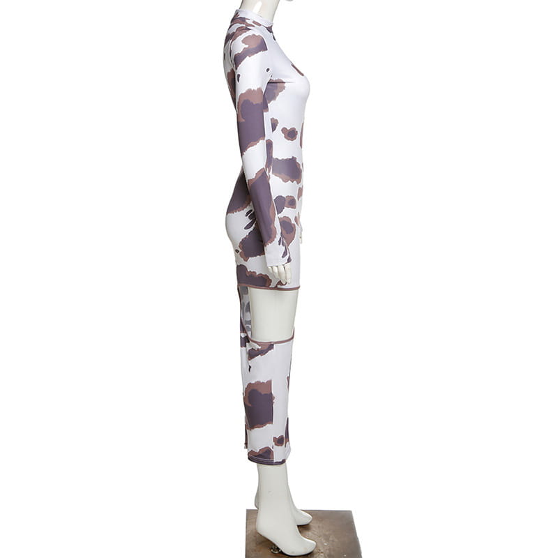 A form-fitting two-piece women irregular hole maxi dress in white and muted purple cow print made of stretchy fabric highlighting the weird puss hollow design.