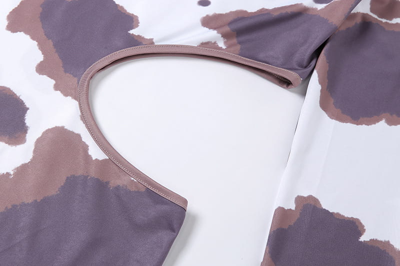a soft mauve-colored fabric strap with neat stitching detail from the women irregular hole cow print irregular hole maxi dress