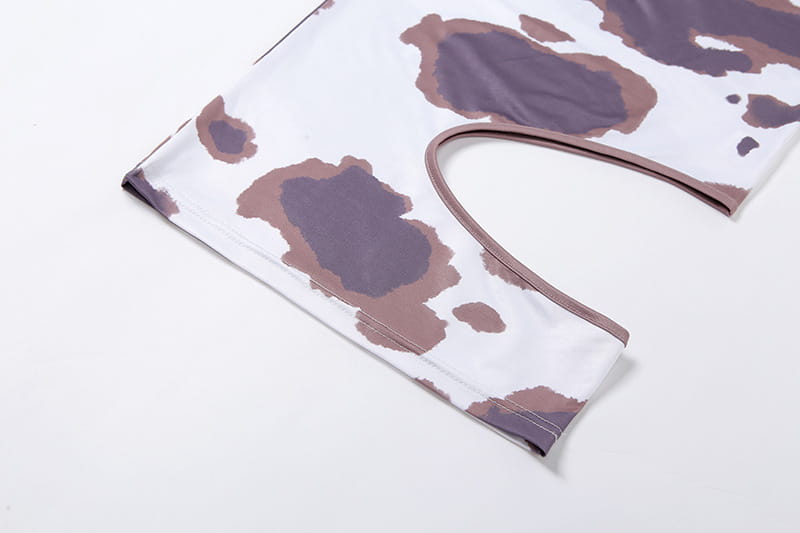 white and brown stretchy seamless cow print leggings featured with a weird puss hollow design suitable for women irregular hole maxi dress look