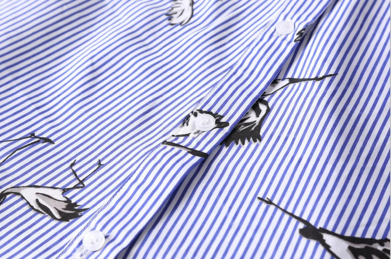 long sleeve striped shirt dress in blue and white with black and white bird illustrations featuring a button-up design ideal for long sleeve women’s casual wear