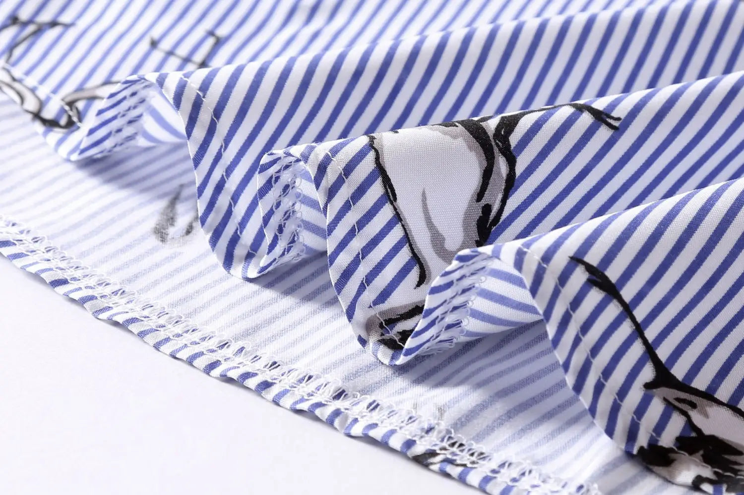 long sleeve striped shirt dress in blue and white fabric with black line-art bird illustrations and delicate lace trim along the edge