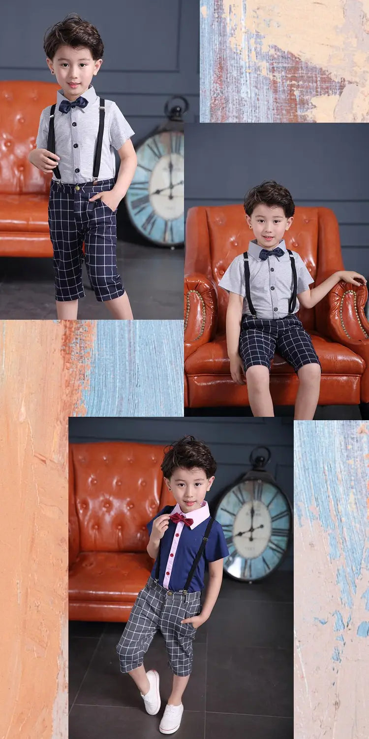 A young boy wearing a men’s plaid suspenders treasure suit tide suit with a light gray short-sleeved shirt, dark blue and white checkered shorts held up by matching suspenders, and a navy or burgundy bow tie.
