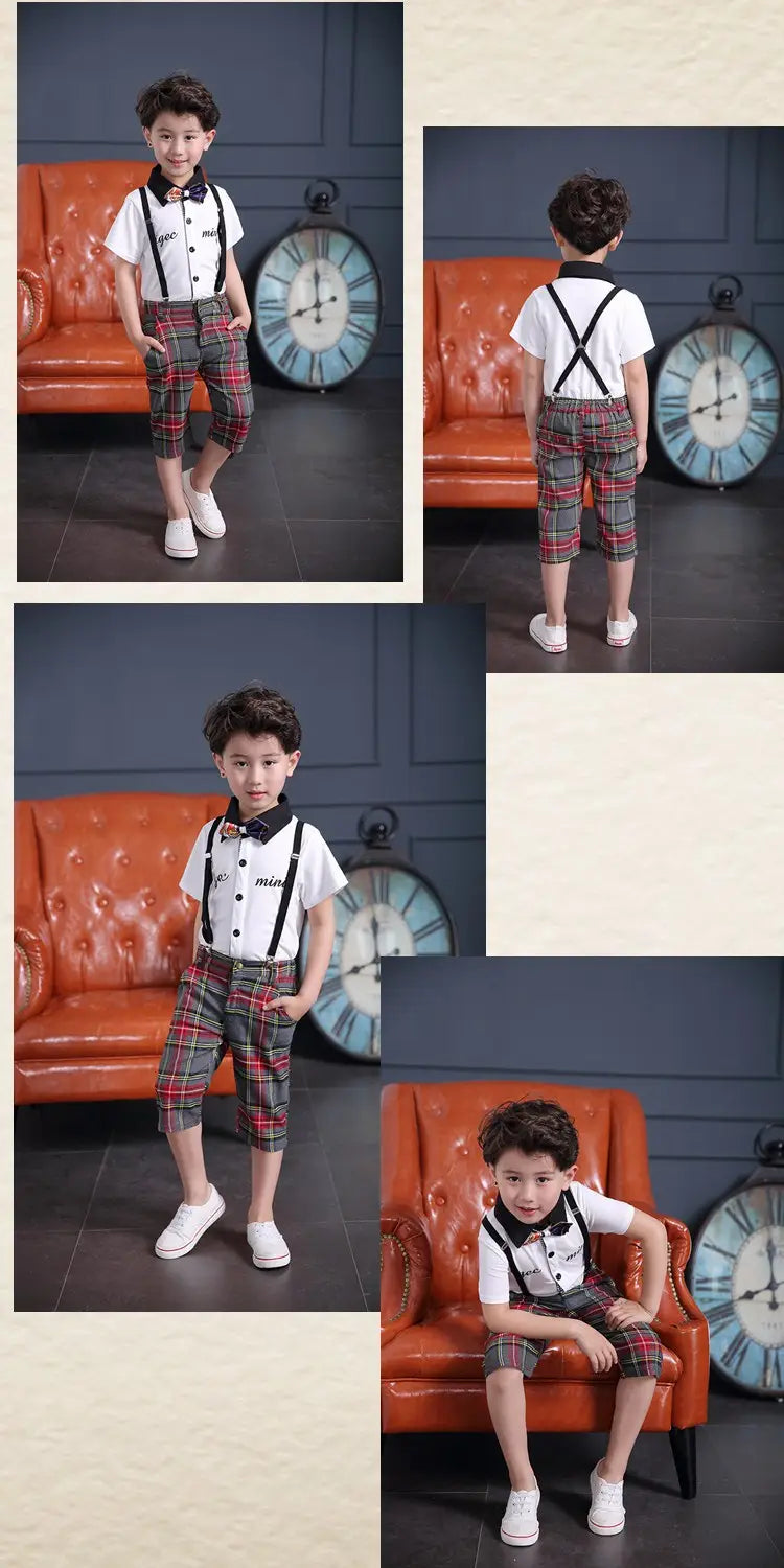 Child wearing a treasure suit tide suit featuring a white short-sleeved shirt with black bow tie and suspenders paired with red green and beige plaid capri pants.