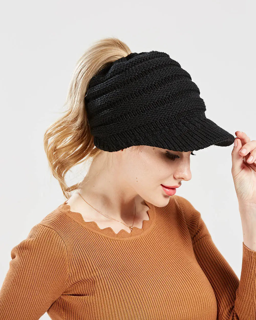 black knitted women ponytail beanie with small brim designed for beanies autumn winter wear
