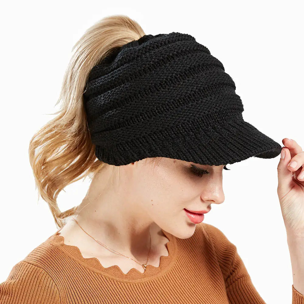 black knitted women ponytail beanie with a small brim suitable for beanies autumn winter collections