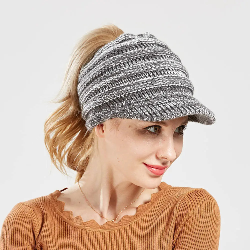 gray and white striped knitted women ponytail beanie with a small brim designed for autumn and winter use