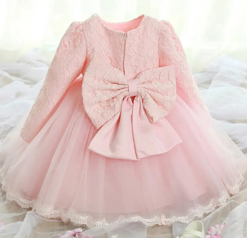 delicate pink lace princess dress girls long sleeve tulle featuring a puffed sleeve bodice and an oversized matching bow at the back