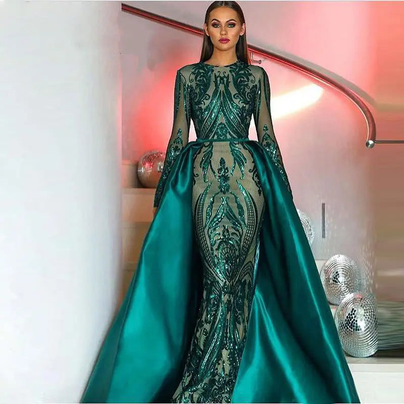 Emerald green satin lace evening dress featuring intricate sequined embroidery and a flowing train showcasing the main fabric composition of satin.