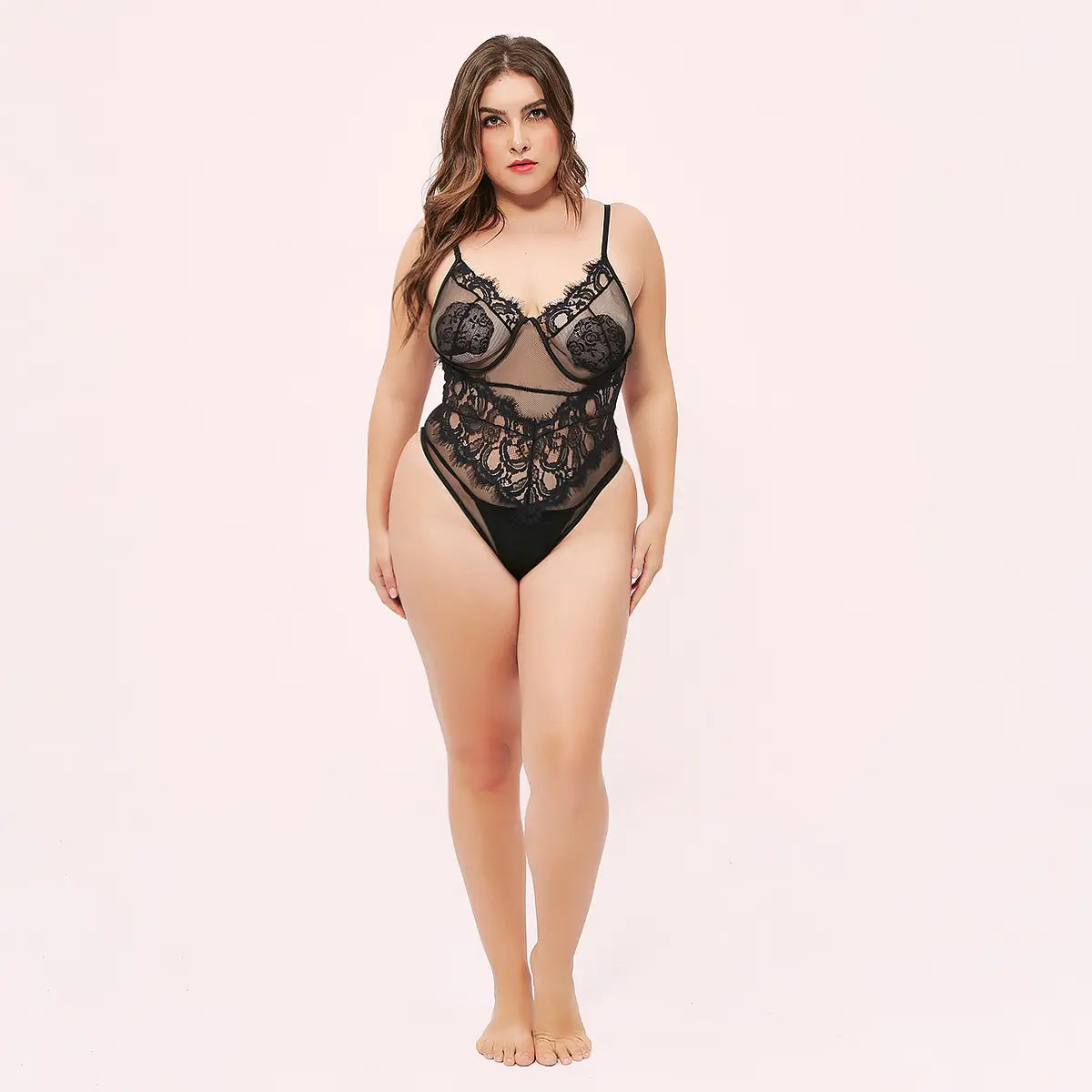 Black floral deep v lace mesh bodysuit featuring a black lace mesh design with intricate floral patterns and sheer panels.