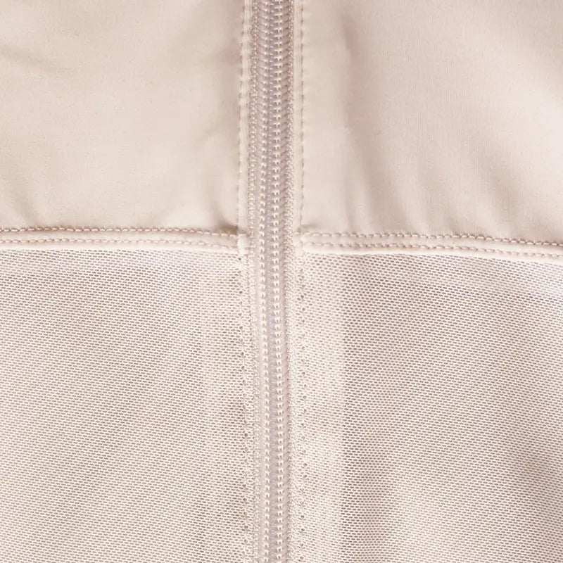 Beige quilted plus size shaping underwear made of fabric with a central front zipper and stitched seams for enhanced support and contouring.