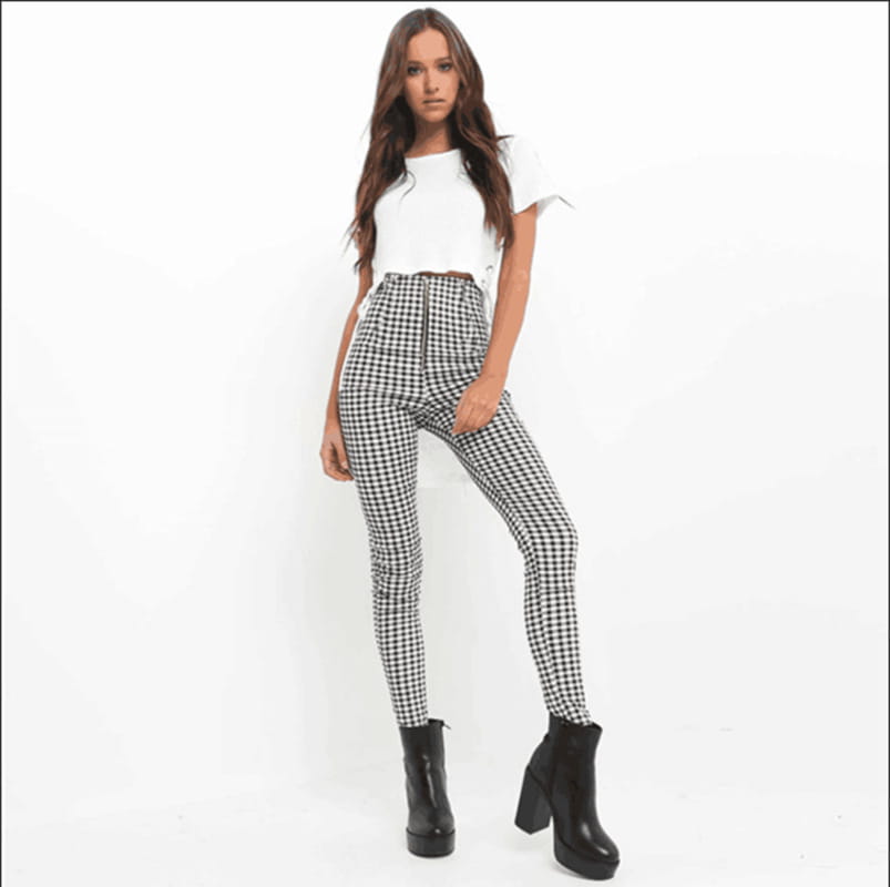 high-waist stretch leggings for women featuring a black and white checkered pattern with a zipper at the waistband.