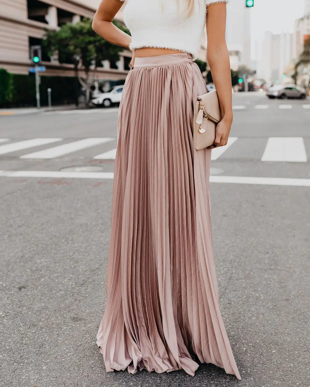 A flowing dusty rose pleated maxi skirt with a high waistband showcasing skirt length and women fashion casual style for a fashion casual skirt.