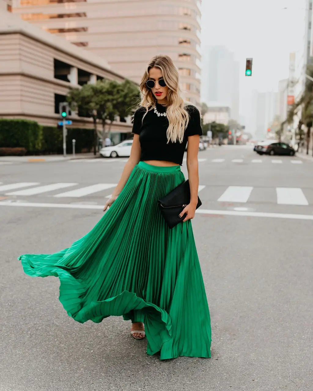 vibrant emerald green pleated maxi skirt with flowing elegant drape suitable for women fashion casual wear featuring a high waist and skirt length design.