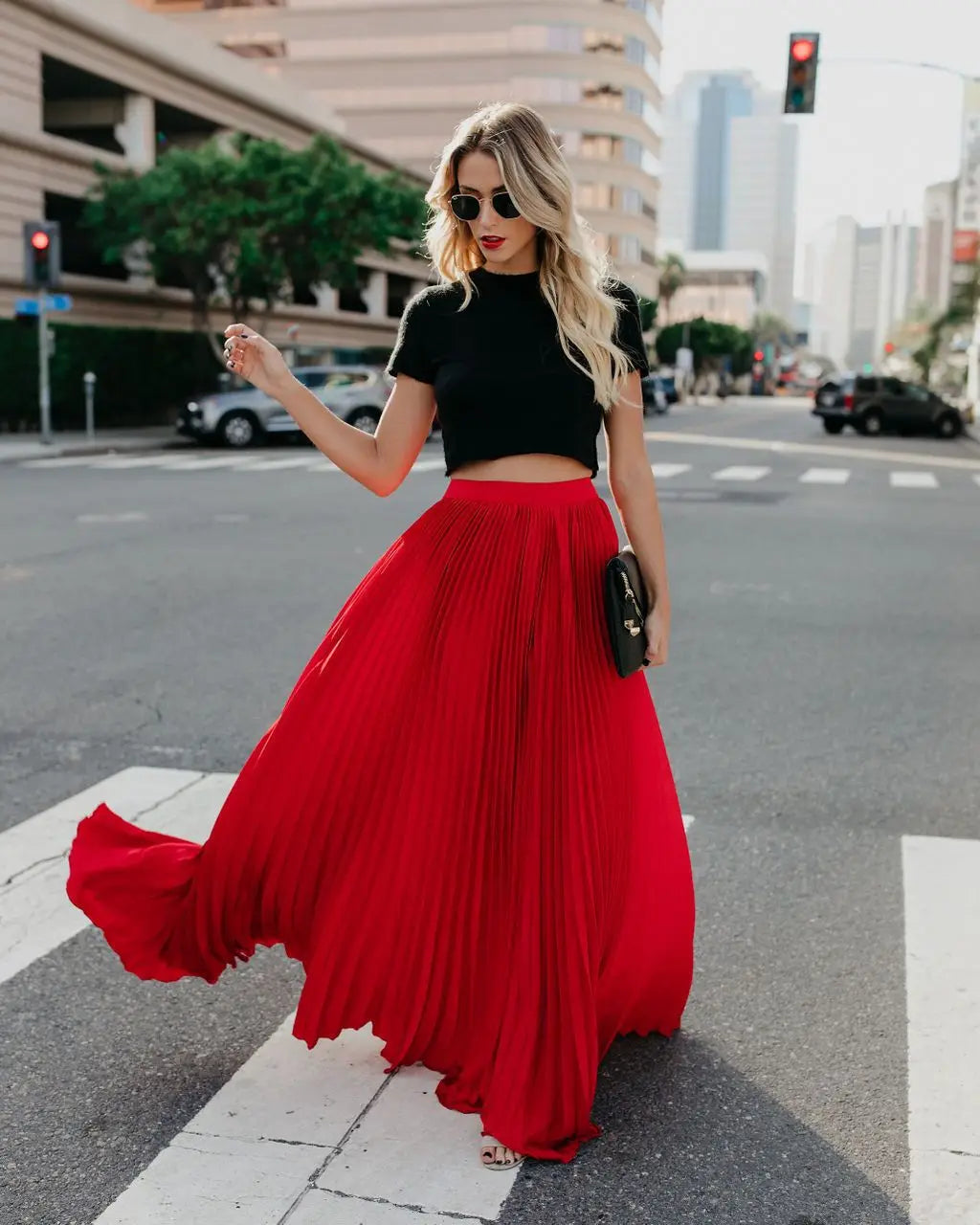 A flowing vibrant red pleated maxi skirt showcasing skirt length and design ideal for women fashion casual and everyday wear.