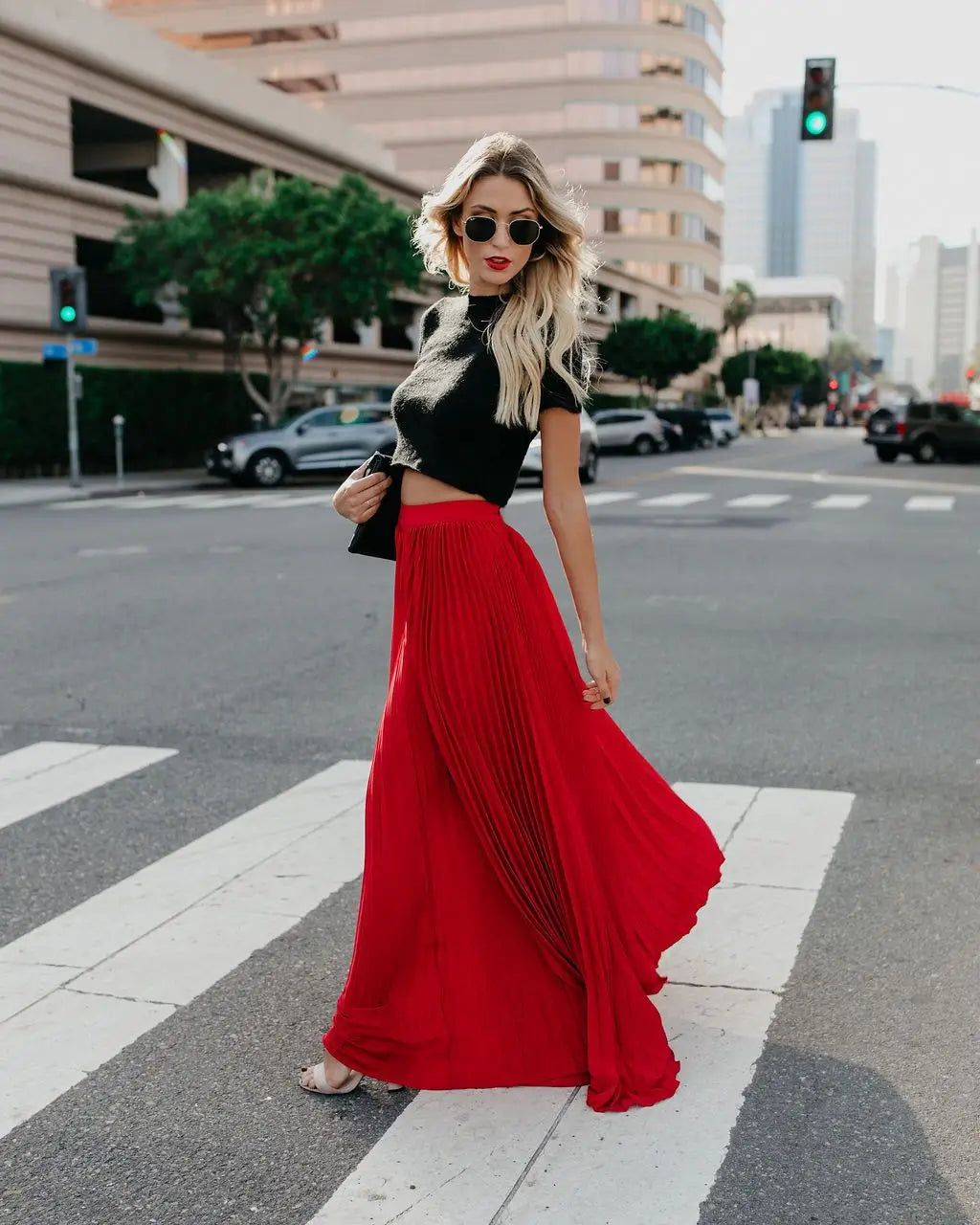 A flowing vibrant red pleated maxi skirt with high waist showcasing women fashion casual skirt length for everyday wear.