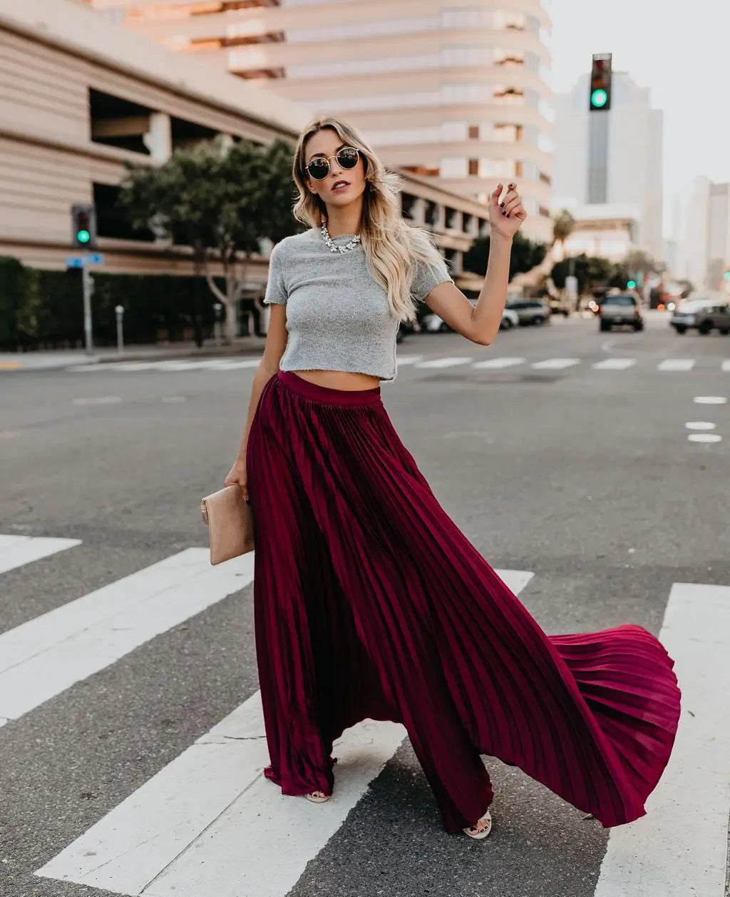 A flowing deep burgundy pleated maxi skirt with a high waist and soft drape perfect for women fashion casual wear.