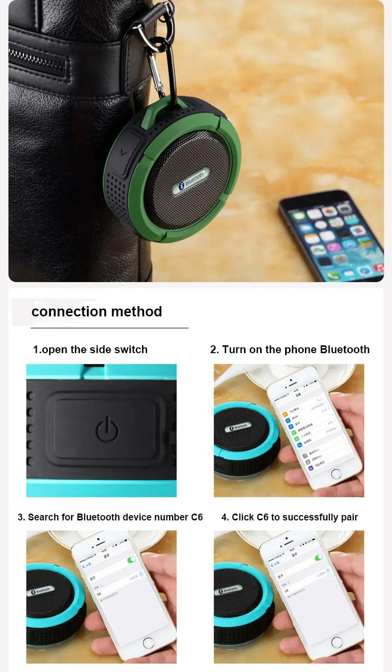 Teal and black portable waterproof speaker with carabiner clip featuring a green and black circular design suitable for outdoor use.