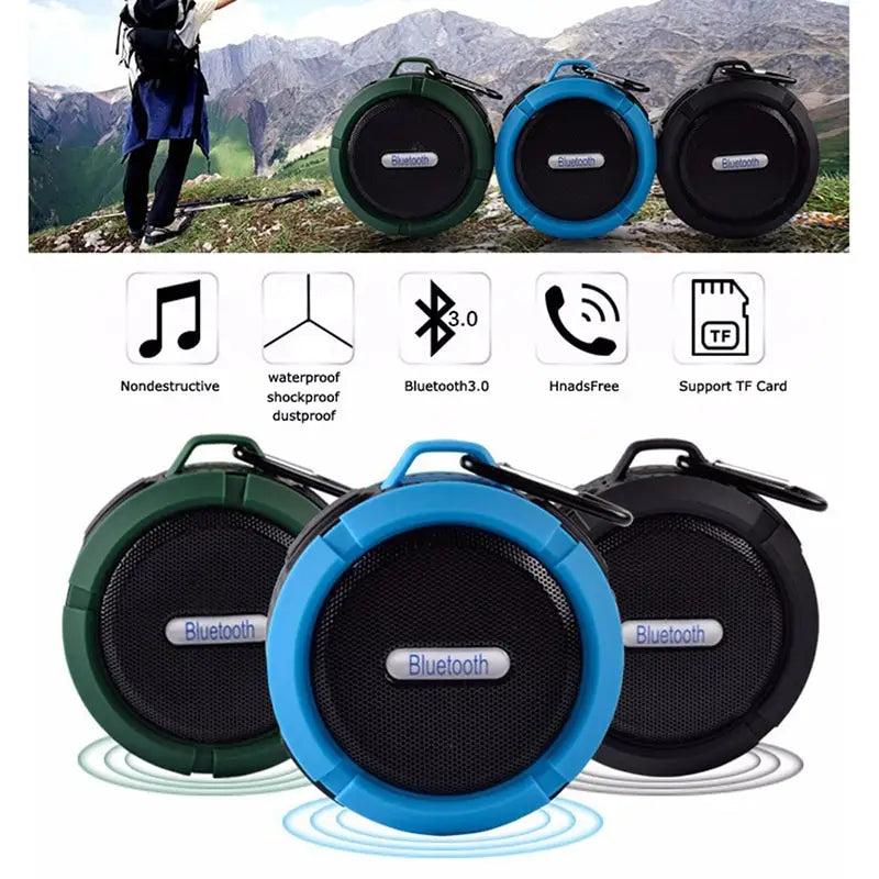 Teal and black portable waterproof speaker featuring a blue circular bluetooth 3.0 design with black mesh grille and carabiner clip suitable for outdoor use and complimenting luxury women’s fashion and plus size dresses bikinis.