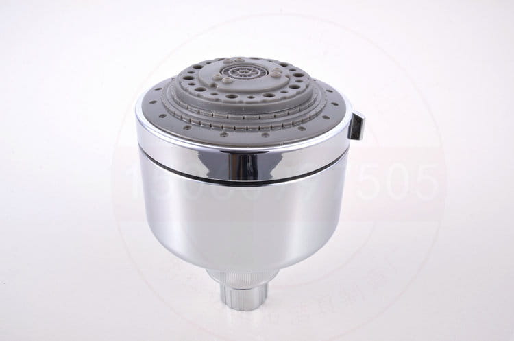 Chrome plastic small shower head with chrome finish, gray multi-hole spray face, and sleek cylindrical body designed as a spray plastic small shower.