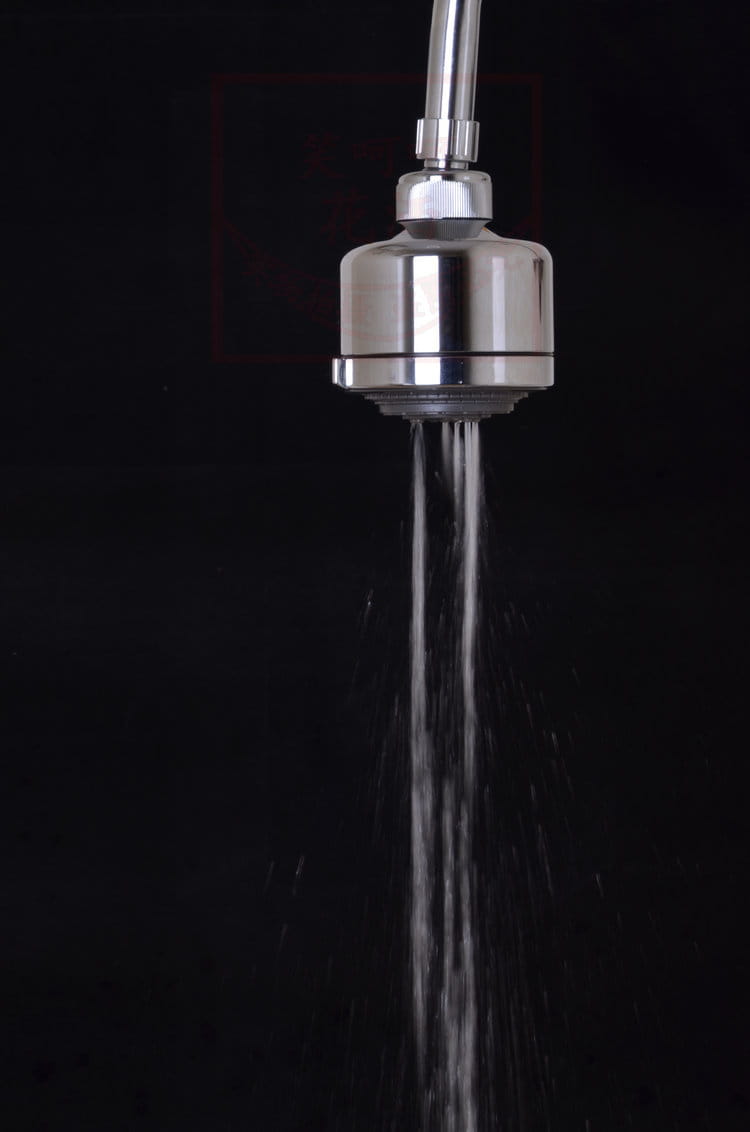 Stainless steel shower head with a sleek cylindrical design and polished finish for a chrome plastic small shower.