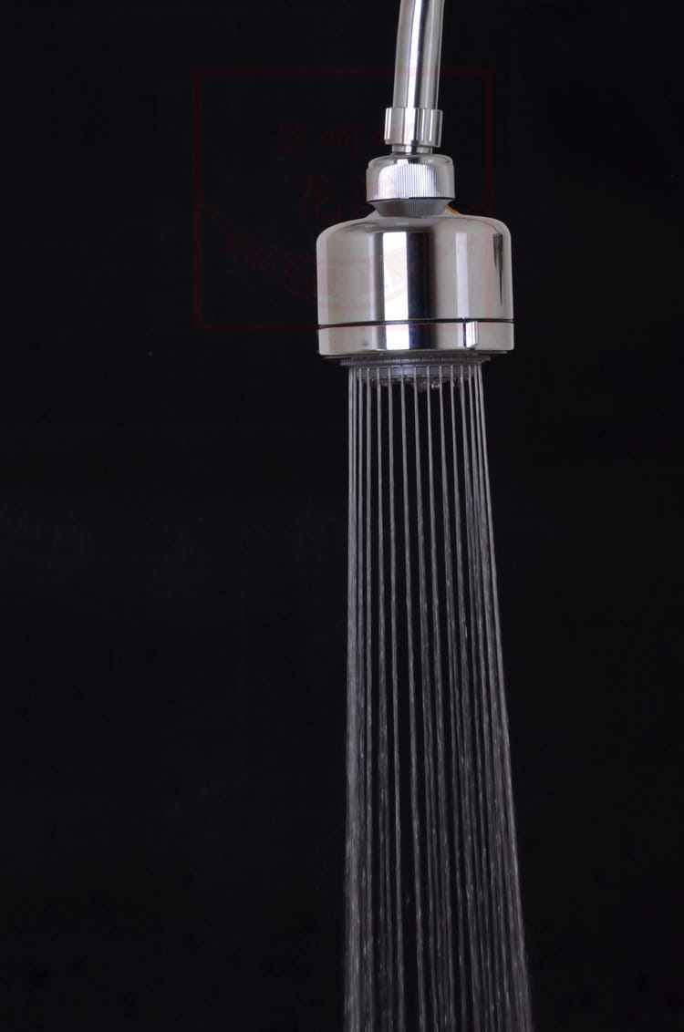 chrome plastic small shower head with a chrome finish and a sleek cylindrical design featuring multiple fine spray nozzles for efficient water flow