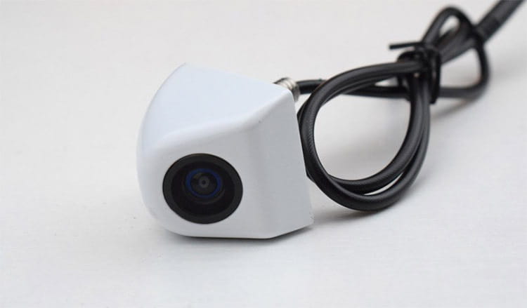 White compact rear view camera with black lens and attached black cable for 4.3 inch led rear view mirror with reversing camera