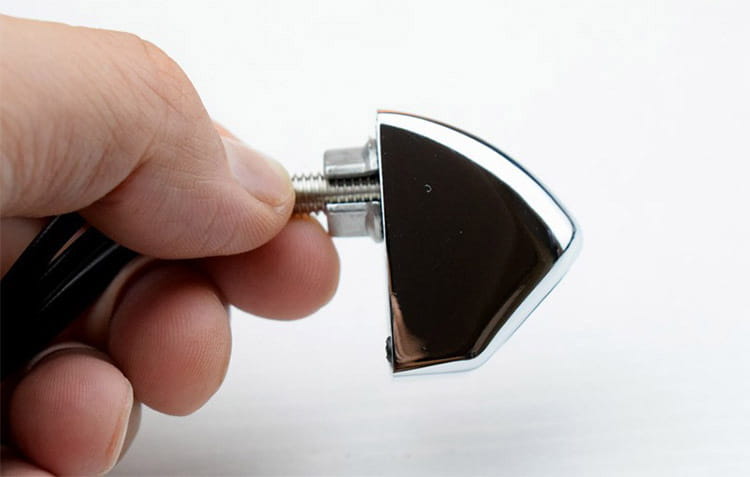 Chrome-finished triangular motorcycle headlight cover with a threaded mounting screw for 4.3 inch led rear view mirror with reversing camera.