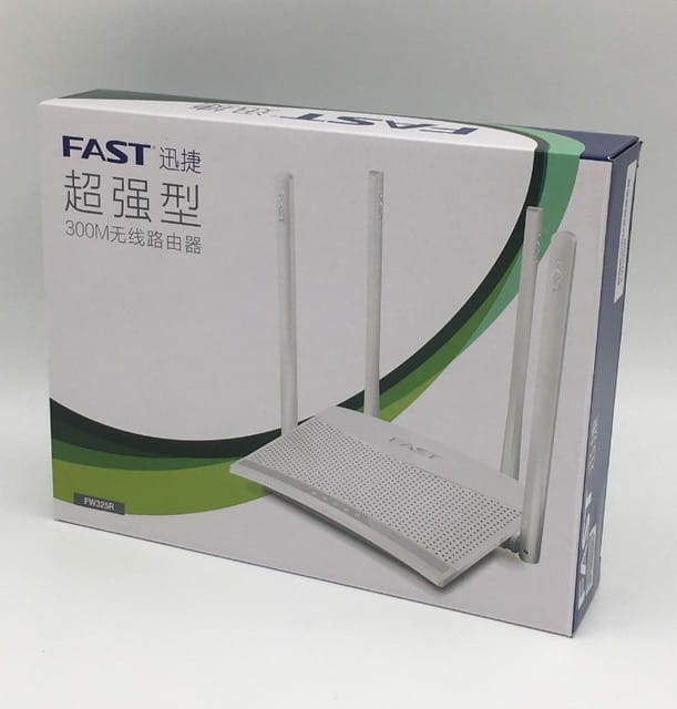White wireless home broadband router with four antennas and a perforated design for efficient home broadband telecommunications.