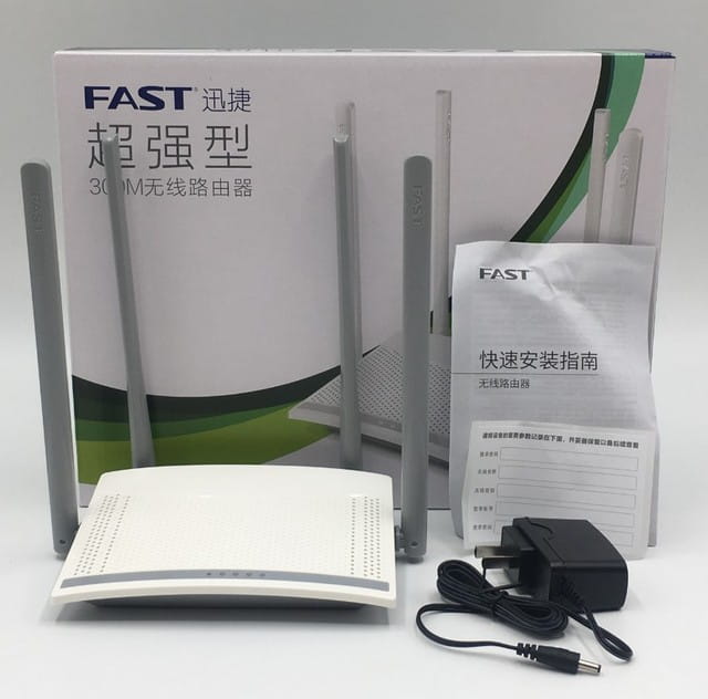 white fast 300m wireless home broadband router with four gray antennas designed for broadband telecommunications use.