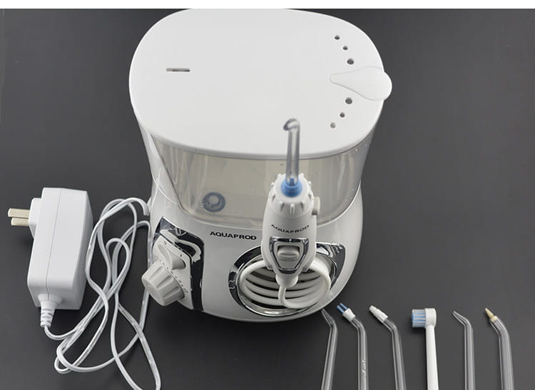 Modern electric tooth punch water flosser in white with chrome accents features a clear tank and multiple interchangeable brush head nozzles for effective oral hygiene.
