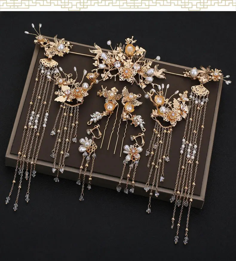 Elegant gold-toned chinese bridal jewelry featuring intricate floral designs adorned with pearls and crystals for bridal use.