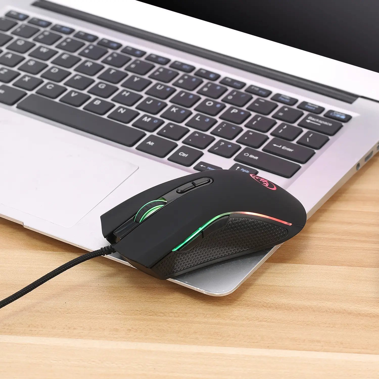 black scorpion rgb luminous gaming mouse featuring a black textured grip surface and colorful luminous gaming lighting for enhanced gameplay experience