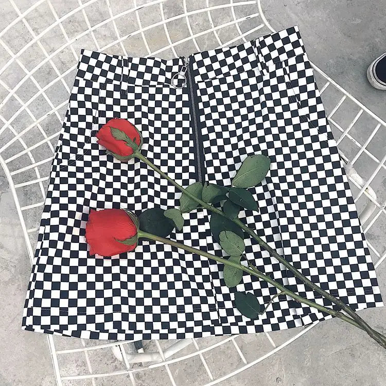 black and white checkered mini skirt with front zipper closure featuring variable mso-font-signature design elements