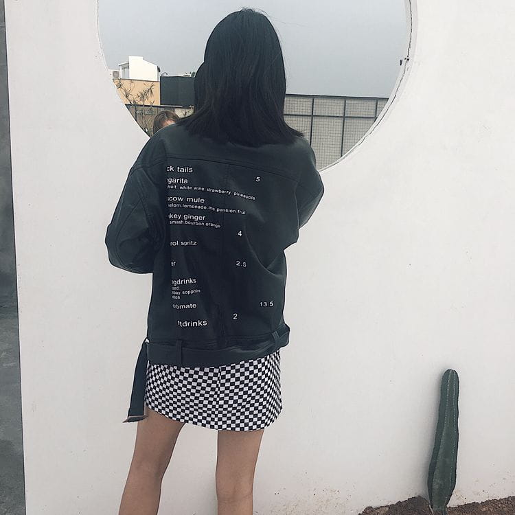 black leather jacket with white text listing cocktail names and numbers on the back featuring variable mso-font-signature design and mso-font-pitch variable elements in the checkered mini skirt variable mso-font-signature product.