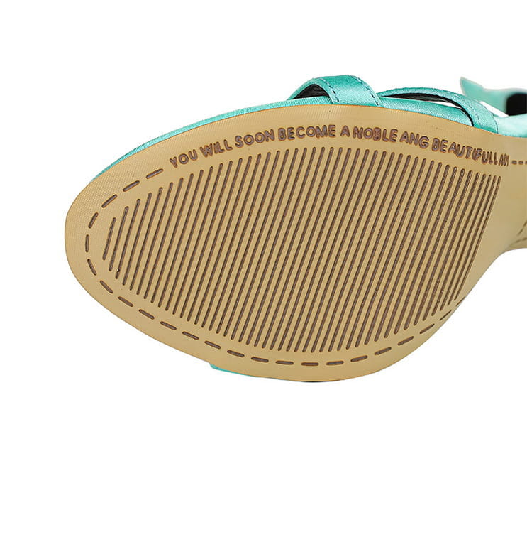 black satin high heel toe cutout sandals featuring a teal satin strap sandal with a tan rubber sole embossed with text.