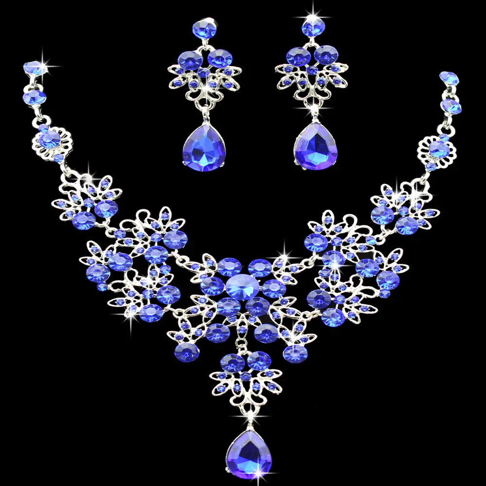 Elegant royal blue crystal butterfly big water drop necklace and matching earring set featuring a silver-toned floral filigree design.