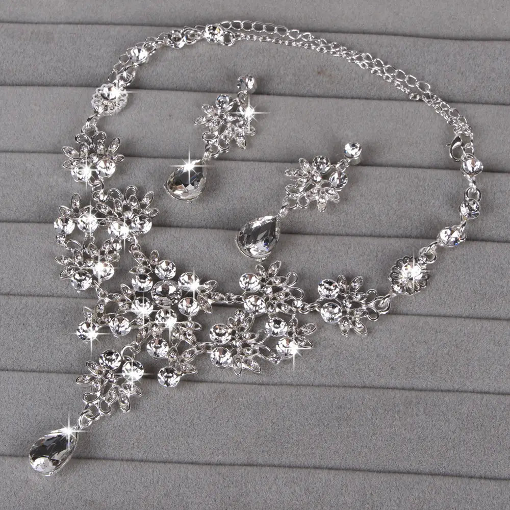 silver crystal necklace with intricate floral design and dangling teardrop pendants from the butterfly big water drop crystal necklace earring set