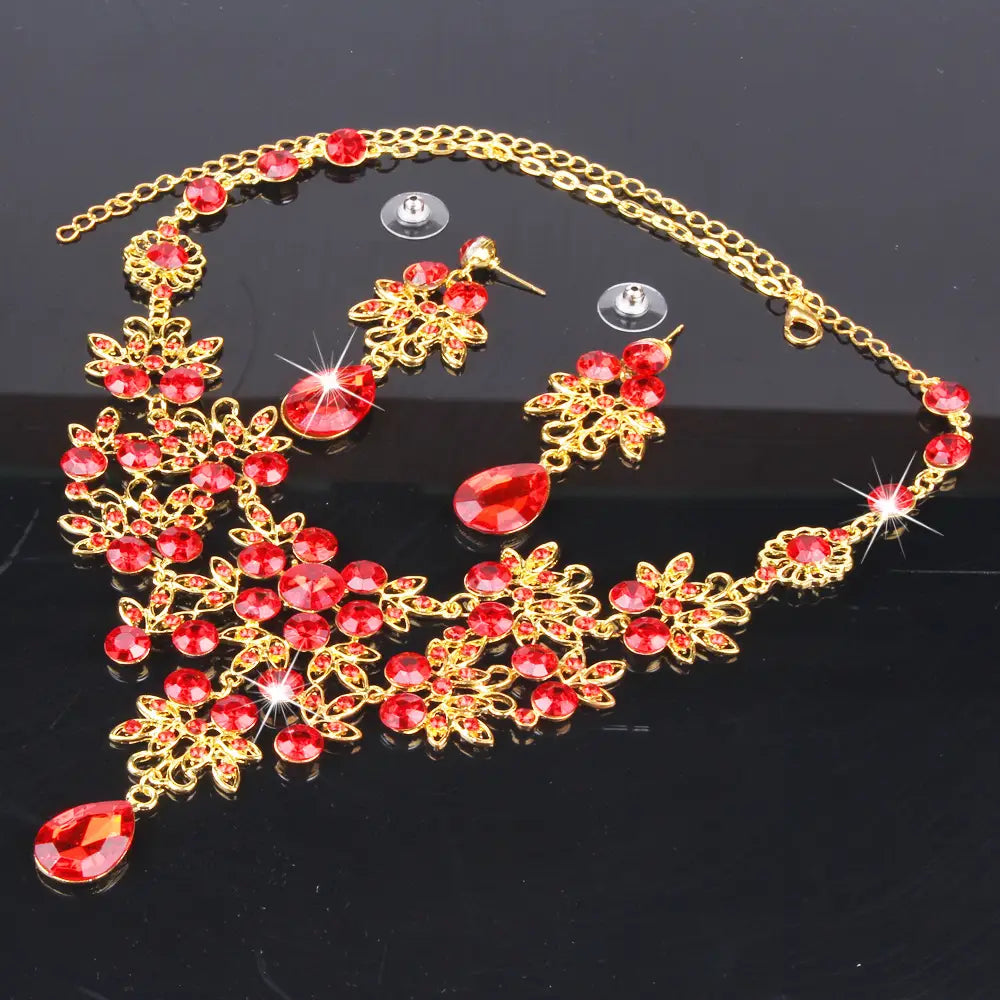 Elegant red crystal butterfly big water drop necklace and earring set with gold-toned floral designs and matching earrings.