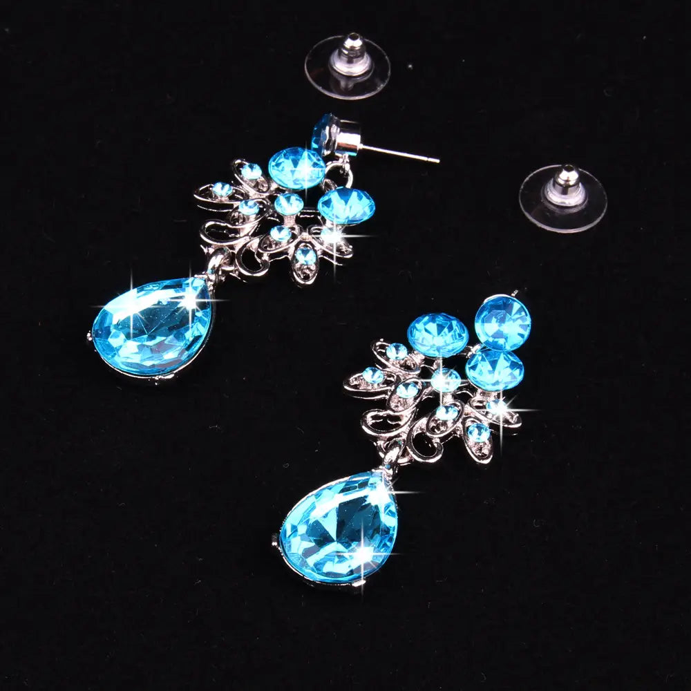 Elegant blue crystal drop earring set featuring silver-toned floral designs and teardrop-shaped stones from the butterfly big water drop collection.