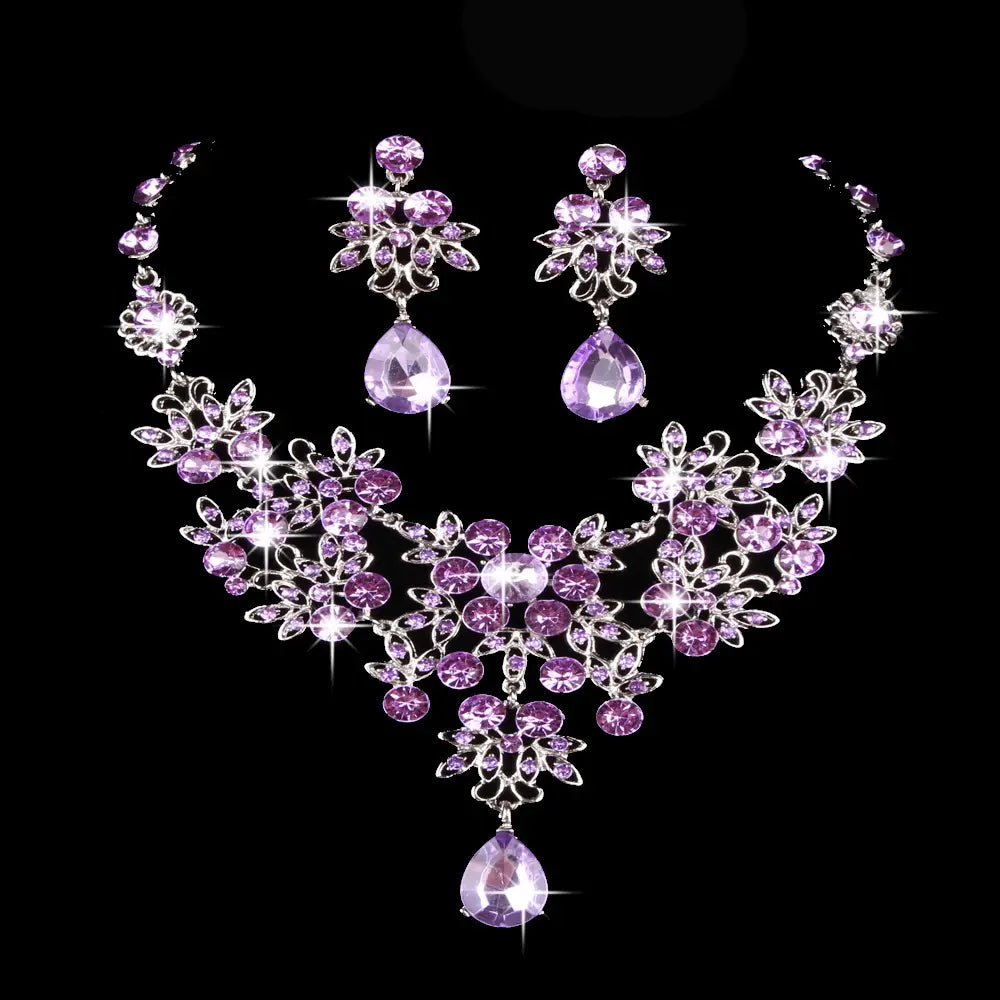 Elegant purple crystal butterfly big water drop necklace and earring set featuring silver-toned floral designs and a teardrop-shaped pendant.