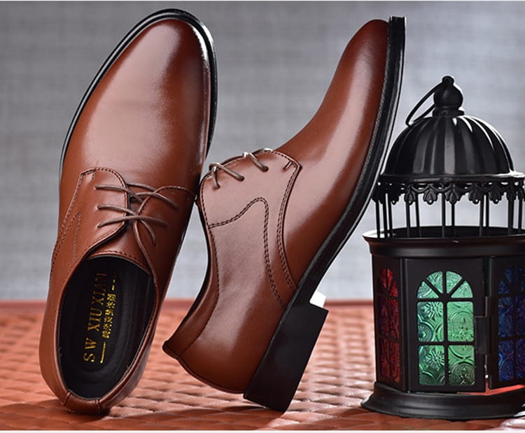 brown pointed toe leather shoes featuring black soles and laces, combining the elegance of luxury women’s fashion with the classic appeal of black shoes.