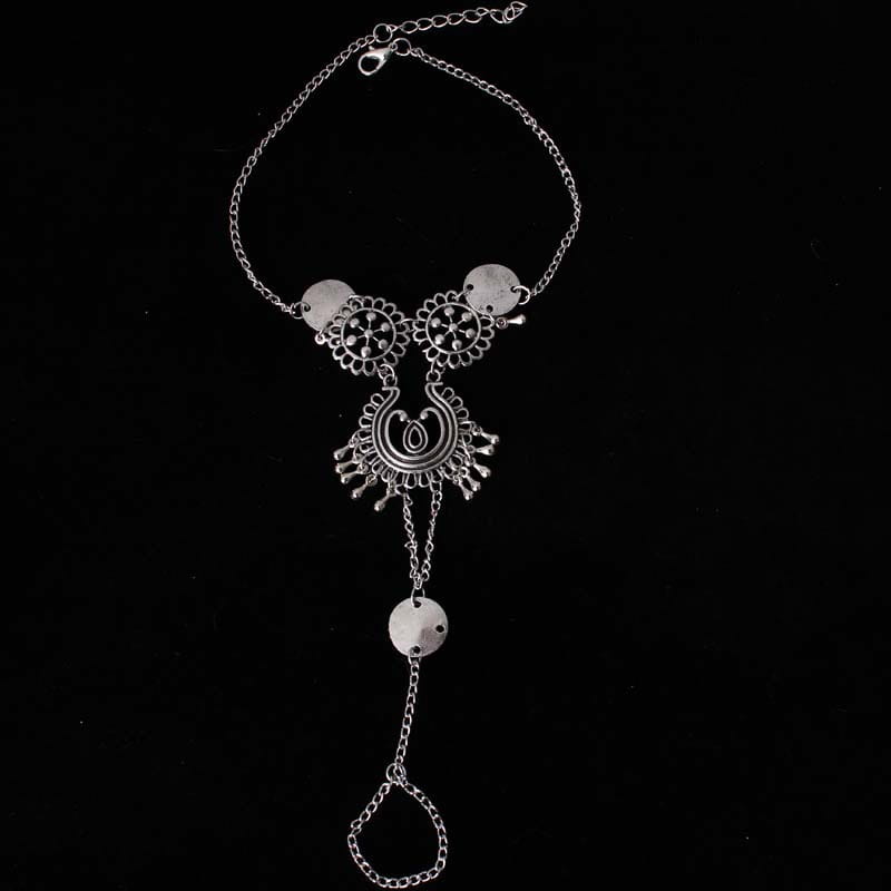 silver-toned bohemian jewelry antique foot chain with intricate floral and crescent moon designs in antique silver color featuring dangling circular medallions and a delicate chain link closure.