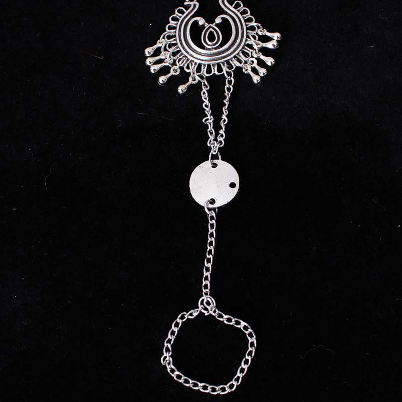Bohemian jewelry antique silver flower foot chain featuring a silver-toned ankle chain with an ornate sunburst-style top piece and a circular disc pendant in antique silver color.