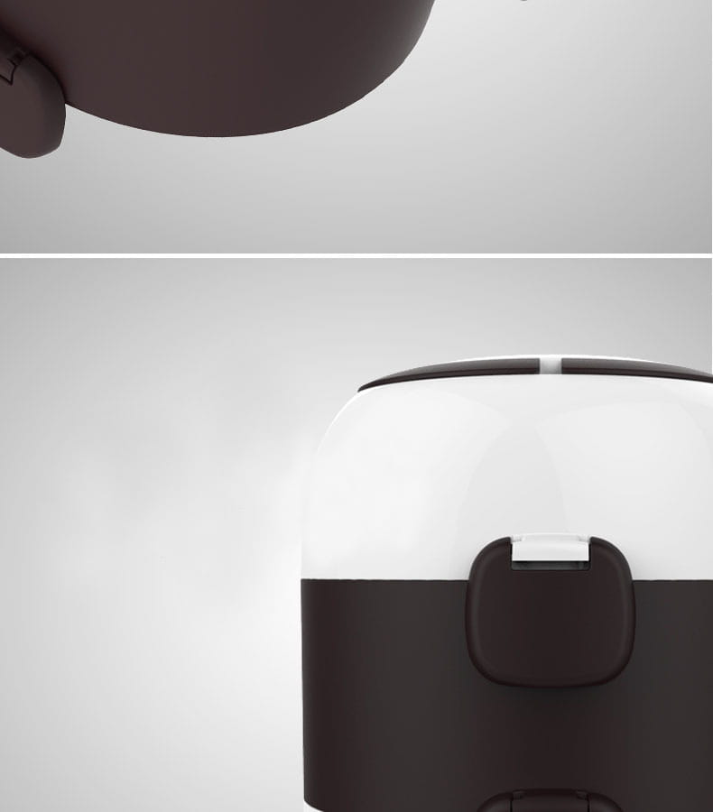 A sleek two-toned electric multi-function lunch box with a glossy white upper half, matte black lower section, and minimalist handle design.