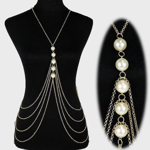 Silver graduated pearl body chain jewelry featuring a silver chain adorned with multiple strands of white pearls as a pearl body chain accessory.