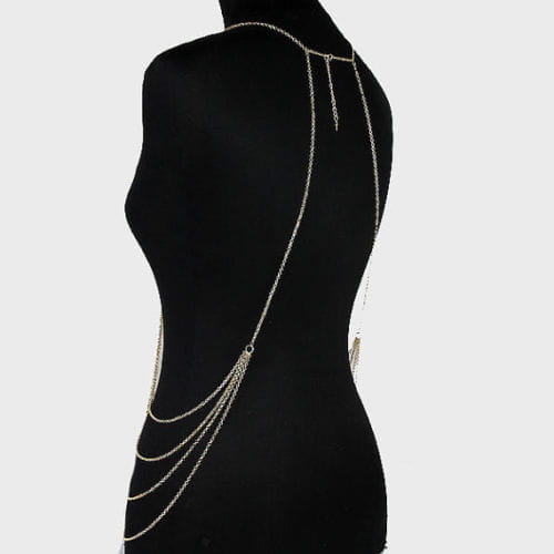 silver graduated pearl body chain jewelry featuring a silver chain body chain with multiple layered strands and dangling tassels