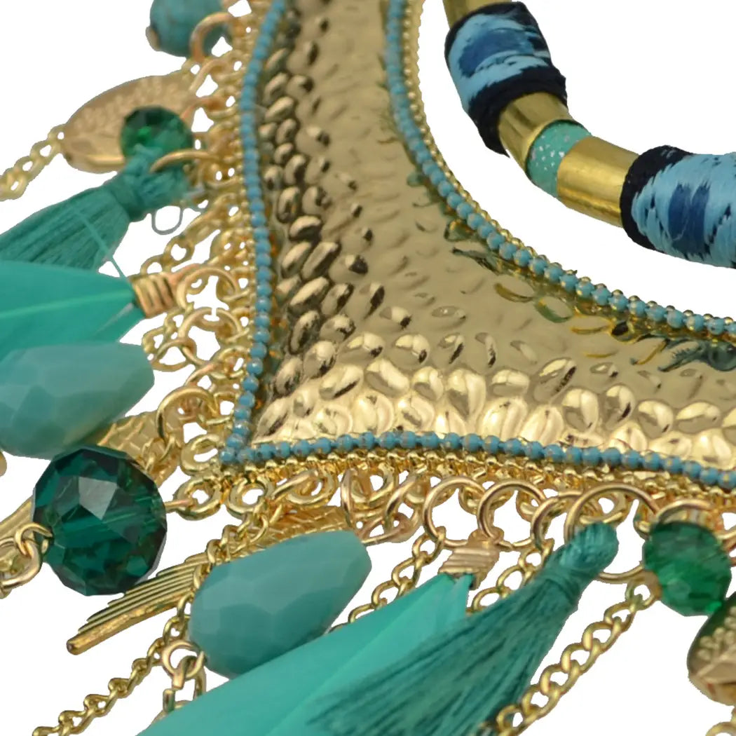 turquoise gold feather leaf tassel necklace featuring a gold-toned hammered metal chain with turquoise tassels, green faceted beads, and blue patterned fabric accents showcasing original jewelry feather leaf design.